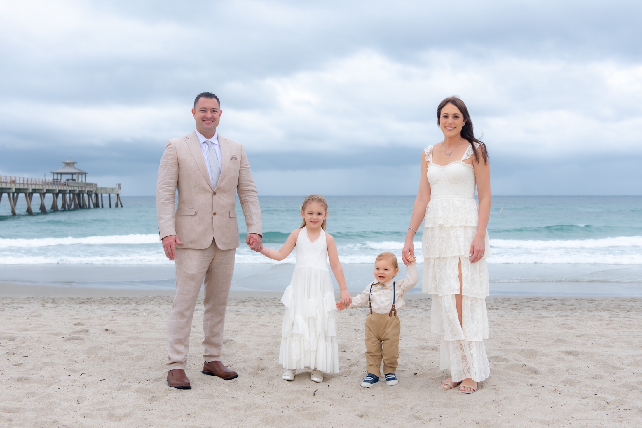 Family celebrating a vow renewal together on a South Florida beach